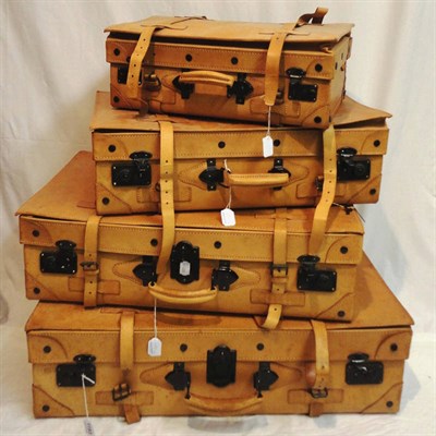 Lot 1193 - Four 'Giovanni' Graduated Tan Leather Suitcases with leather straps and lined in a brown...