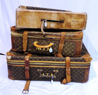 Lot 1195 - Two Graduated Monogrammed Louis Vuitton Suitcases, with zips running around the side, leather trims