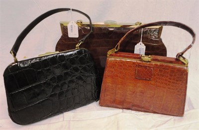 Lot 1198 - Large Brown Crocodile Leather Handbag with gilt metal hinge and fittings resembling buckles,...