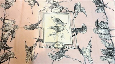 Lot 1206 - Hermès Silk Scarf 'Perruches', designed by Xavier de Poret depicting parrots on a soft pink...