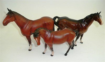 Lot 32 - Two matt Beswick bay horses and another in gloss