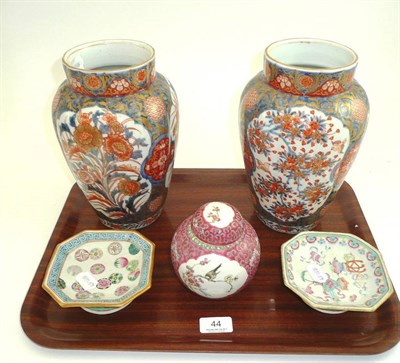 Lot 44 - A pair of Japanese Imari vases, two Chinese porcelain stands and a ginger jar and cover
