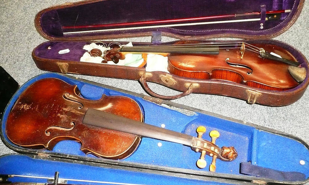 Lot 55 - Two cased violins with bows