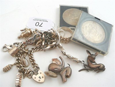 Lot 70 - A silver charm bracelet, another bracelet, two brooches, a keeper ring and three coins