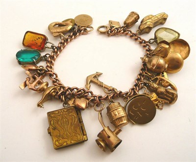 Lot 81 - A 9ct gold charm bracelet with twenty six assorted charms plus one loose charm