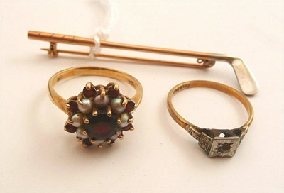 Lot 85 - A 9ct gold golf club stick pin, a garnet and pearl cluster ring and a 9ct gold solitaire ring