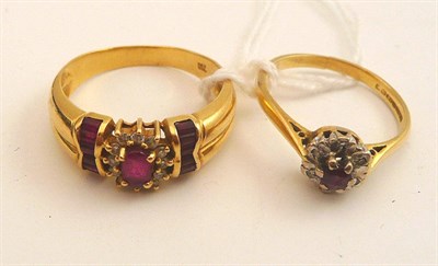 Lot 96 - An 18ct gold ruby and diamond cluster ring and another, stamped ";750"