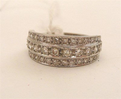 Lot 114 - A diamond three row ring