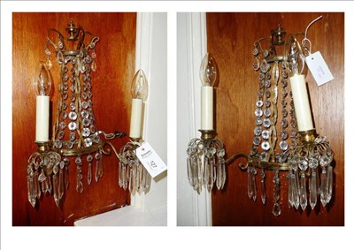 Lot 127 - A pair of gilt metal wall lights