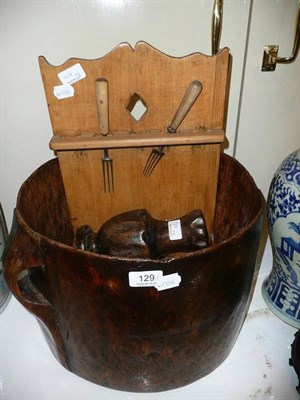 Lot 129 - A Scandinavian large turned wood vessel, a pine spoon rack, carved wood vase, two spoons etc