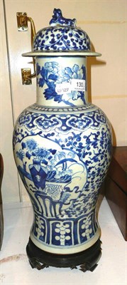 Lot 130 - A large 19th century Chinese blue and white baluster vase and cover decorated with vases upon...