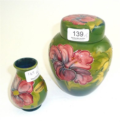 Lot 139 - Walter Moorcroft Hibiscus ginger jar and cover and a clematis vase (2)