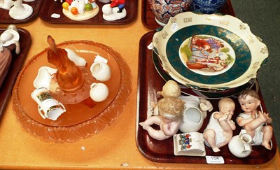 Lot 154 - A tray of ceramics and glass including four German bisque piano babies, miniature crested ware,...