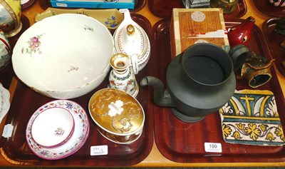 Lot 199 - Two trays of decorative ceramics including two English tea bowls and saucers, pottery tile,...