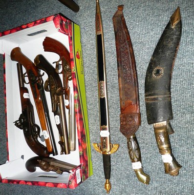 Lot 202 - A Kukri, two Indian daggers and five replica pistols