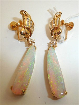 Lot 230 - A pair of opal and diamond earrings, with screw-on fittings, stamped '750'