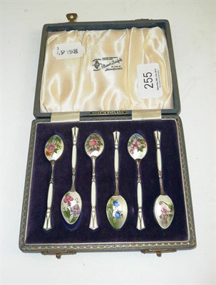 Lot 255 - A cased set of six silver and enamel coffee spoons