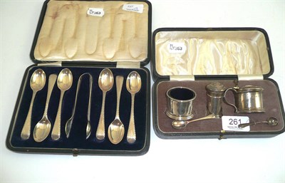 Lot 261 - A three piece silver cased cruet and a set of cased silver teaspoons and tongs