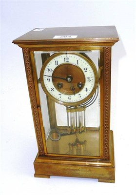 Lot 294 - A brass four glass clock with mercury compensating pendulum