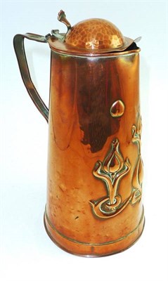 Lot 297 - An Arts and Crafts copper jug with hinged lid, of stylised design