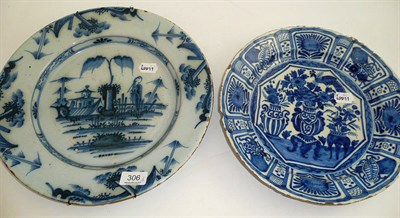 Lot 306 - An 18th century Delft charger and a similar smaller dish (a.f.)