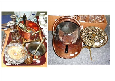 Lot 307 - A copper coal helmet, a brass trivet, a footman, two plated wine coasters, plated candlesticks, etc