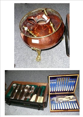 Lot 312 - A canteen of plated flatware, a cased set of fish eaters, brass and copper planter, copper jug...