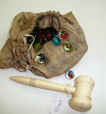 Lot 327 - An ivory auctioneer's gavel and a bag of marbles