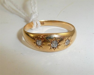 Lot 329 - 18ct gold three stone diamond ring