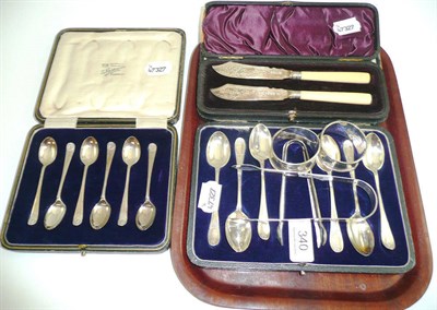 Lot 340 - Two cased sets of silver tea and coffee spoons, a cased pair of silver butter spades, two...