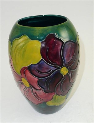 Lot 354 - A Walter Moorcroft Clematis vase on a green ground