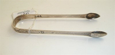 Lot 397 - A pair of Newcastle silver bright cut tongs