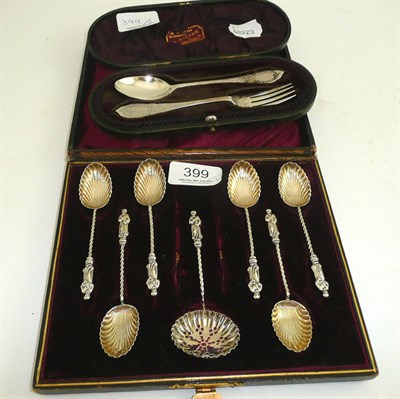 Lot 399 - A set of teaspoons and sifter, cased, and a cased Christening fork and spoon