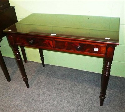 Lot 476 - A 19th century mahogany writing table with two drawers and glass protector