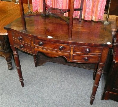 Lot 497 - A George IV mahogany small bow front sideboard/washstand