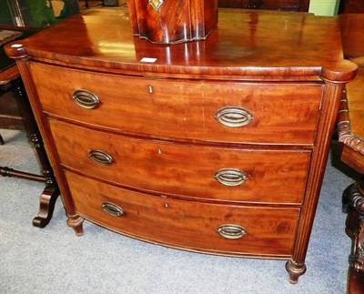 Lot 519 - A 19th century mahogany bow front commode chest of three drawers