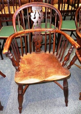 Lot 537 - A 19th century yew and elm low back Windsor chair with crinoline stretcher