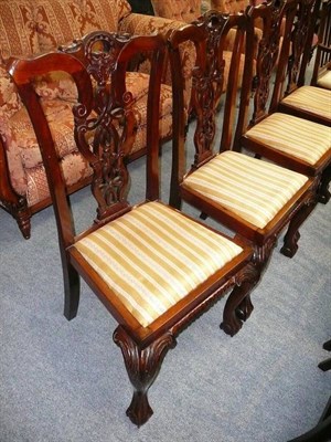 Lot 543 - Set of four mahogany dining chairs in the Chippendale style