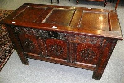 Lot 557 - An oak coffer