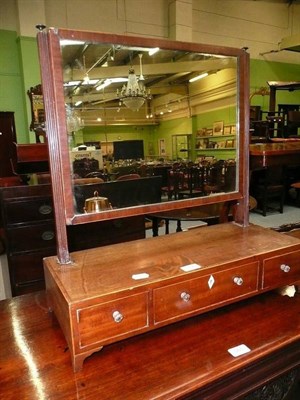 Lot 564 - A 19th century mahogany toilet mirror with two drawers to the plateau