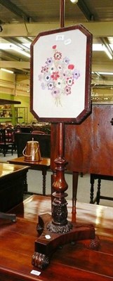 Lot 574 - A Victorian mahogany pole screen with floral panel