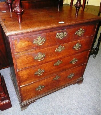 Lot 577 - A George III oak chest of four drawers