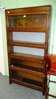 Lot 614 - An oak five height stacking bookcase