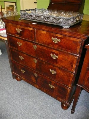 Lot 622 - Walnut four height chest of drawers