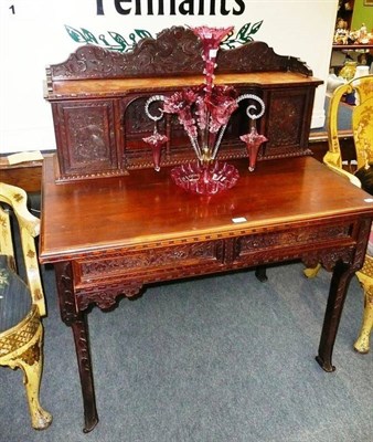 Lot 632 - An Oriental carved hardwood desk