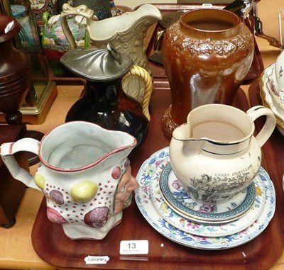 Lot 13 - Tray of decorative ceramics including mask jug, pottery jugs, Masonic transfer printed jug,...