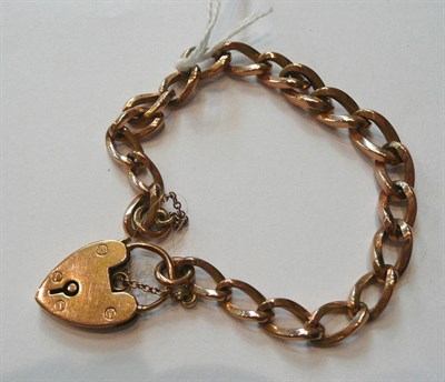 Lot 60 - A rose gold curb and lock bracelet (a.f.)