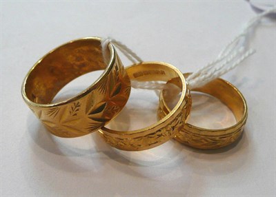 Lot 71 - Three 22ct gold patterned band rings