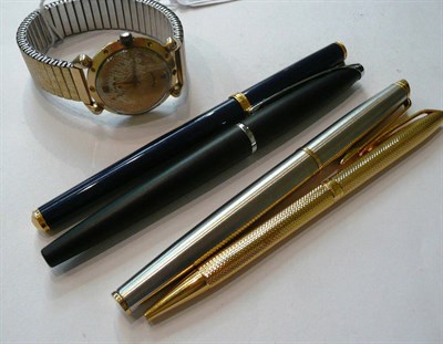 Lot 79 - Four pens and a gilt wristwatch