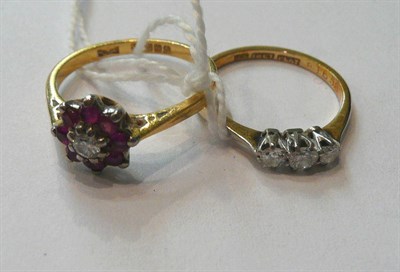Lot 85 - An 18ct gold diamond and ruby cluster ring, and a diamond three stone ring stamped '18CT' and...